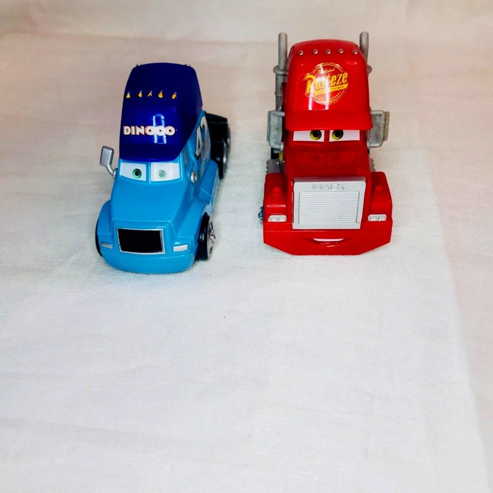 Disney Pixar Cars DInoco & Rus-eze Mack Lot Of 2 Semi Trucks